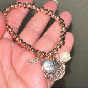 Rose gold peace charm beaded bracelet